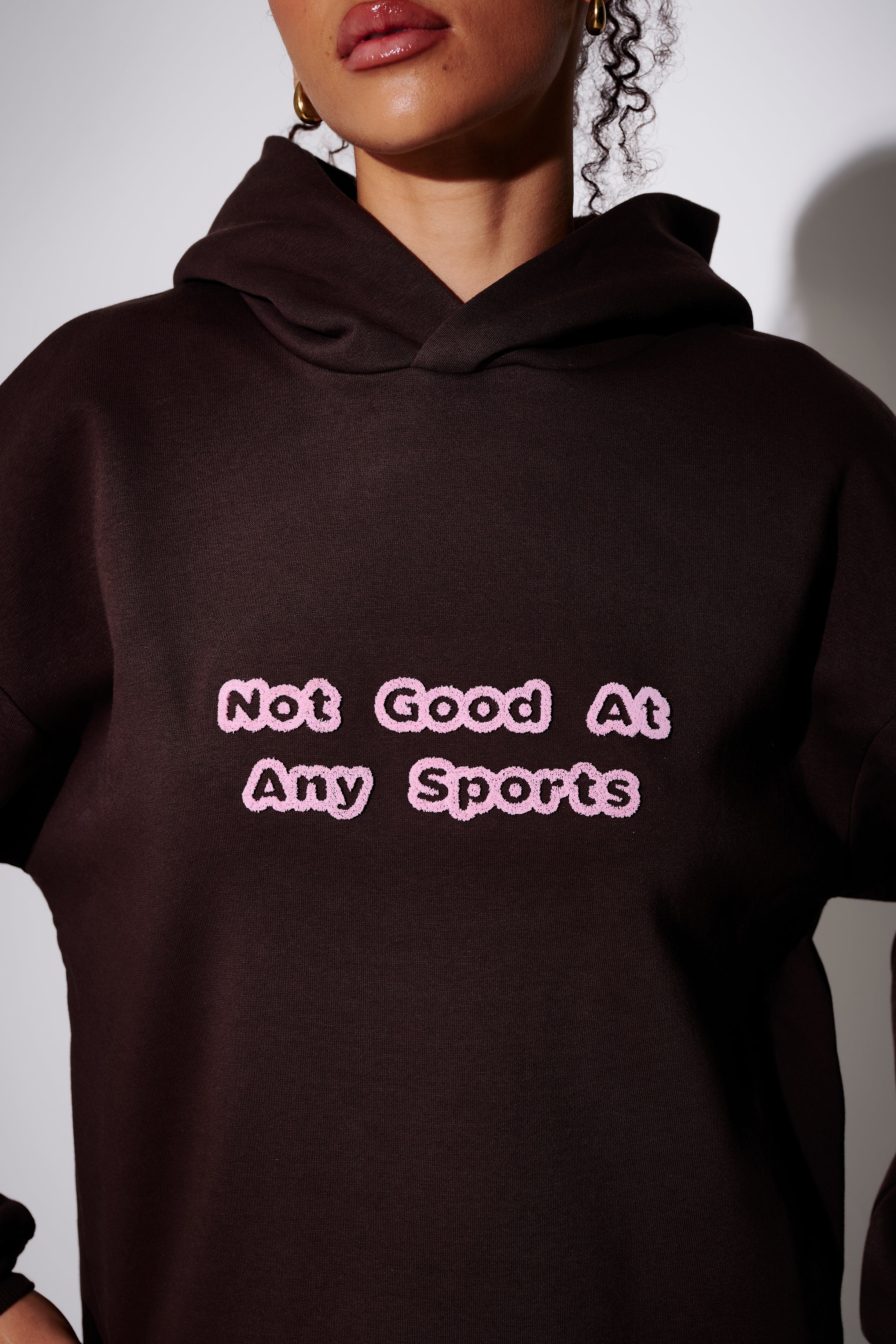 Not Good At Any Sports Graphic Hoodie in Brown & Pink - Image 2